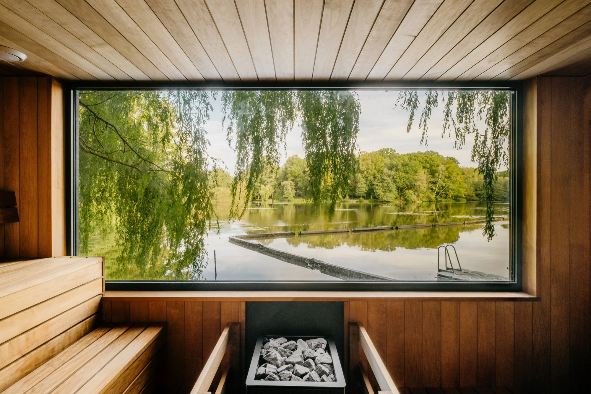 The lakeside sauna at Crafted at Powdermills, looking out over the water