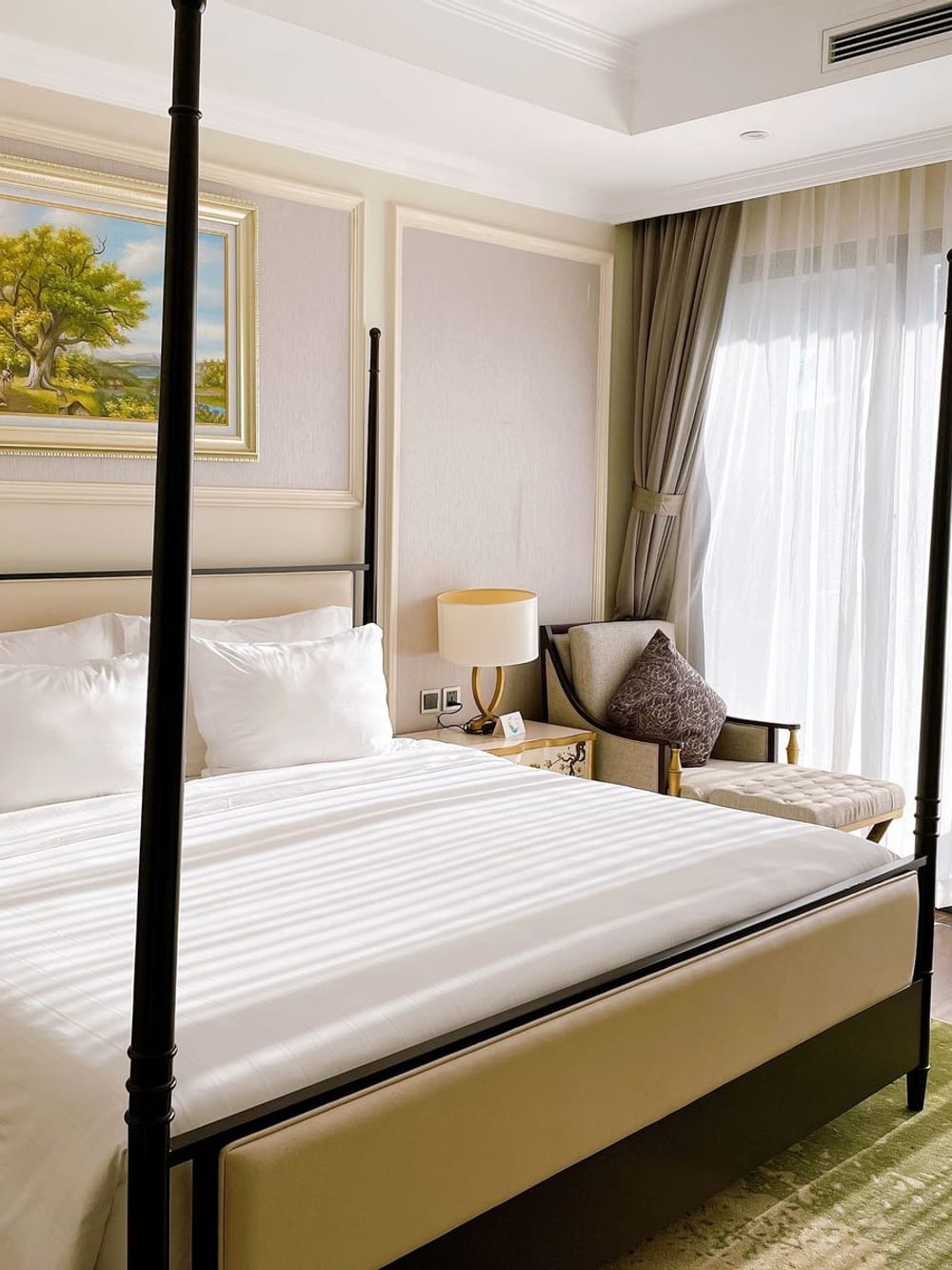 A four-poster bed in a country hotel room – Guest room