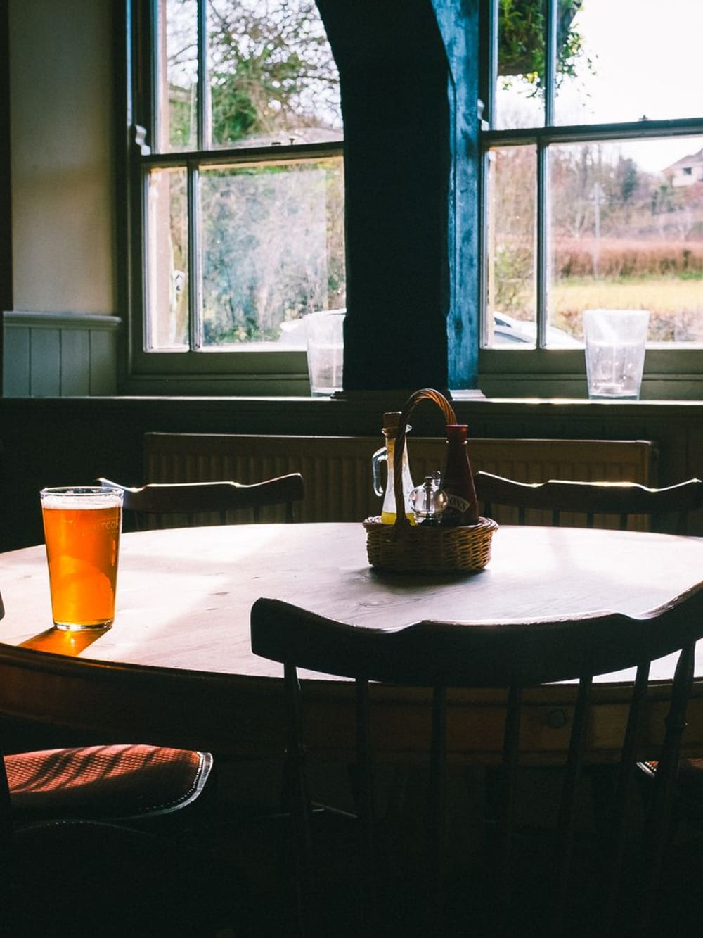 A pint on a table by a pub window – Country pub