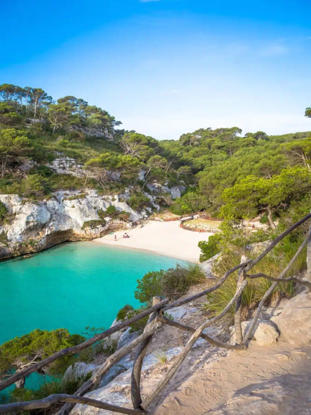 A turquoise cove with a white-sand beach – Menorca coast